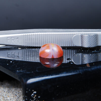 نگین عقیق پرتقالی دو رنگ بیضی 1.41 گرم