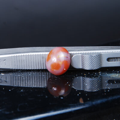 نگین عقیق پرتقالی دو رنگ بیضی 1.41 گرم